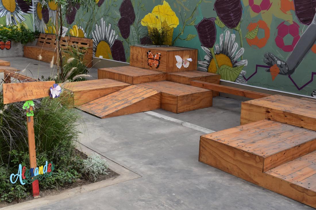 Wooden ramps and play platforms decorated with paper butterflies